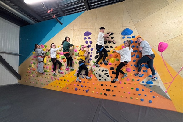 Pediatric residents on an indoor climbing wall