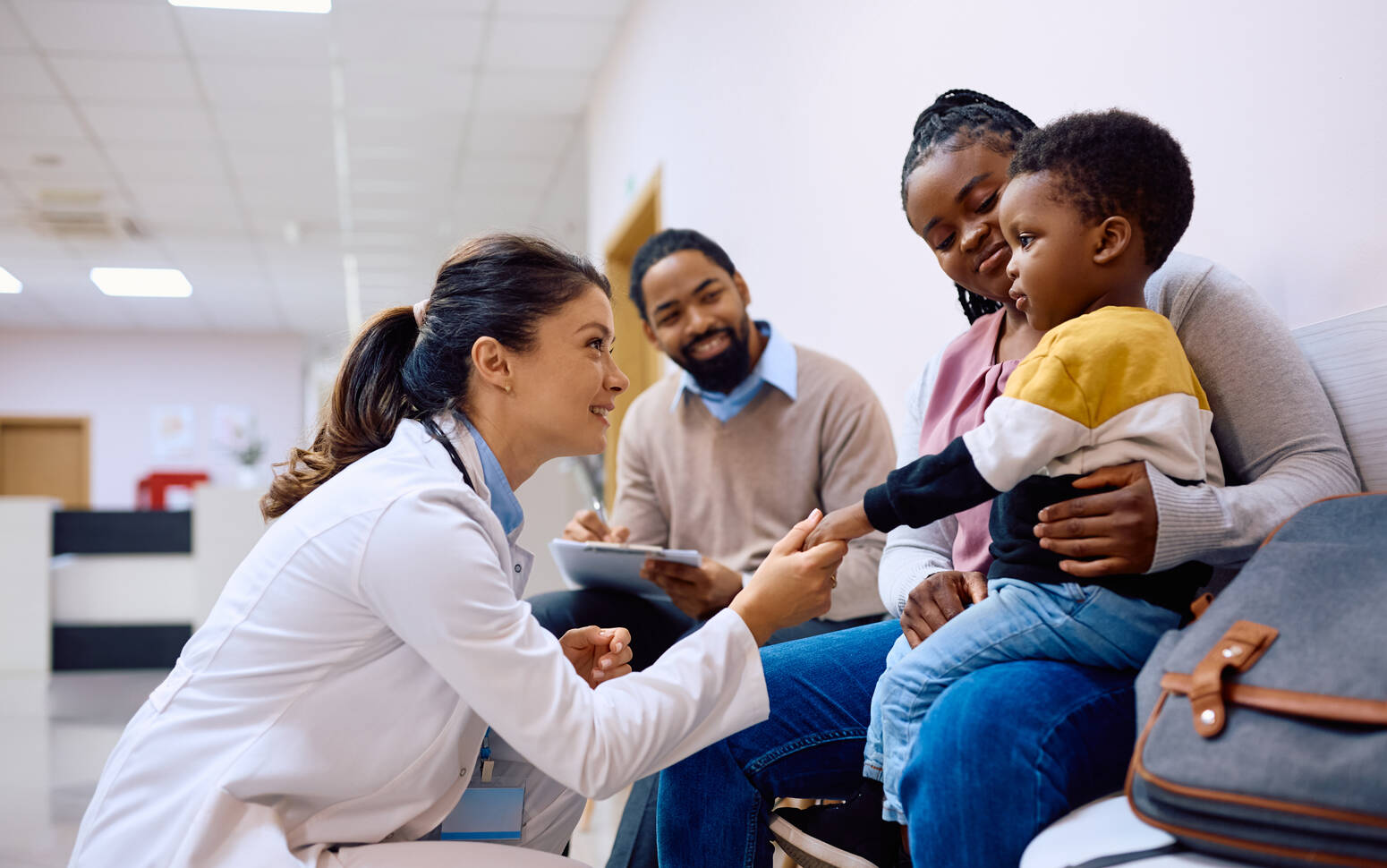 pediatric doctor talking with family 