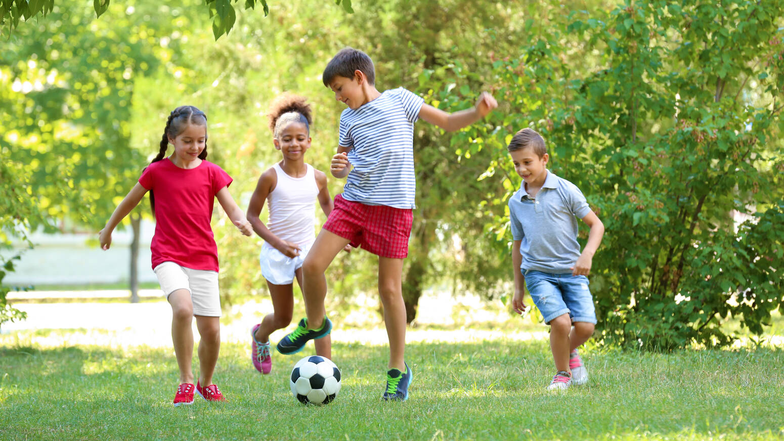 Young kids playing soccer