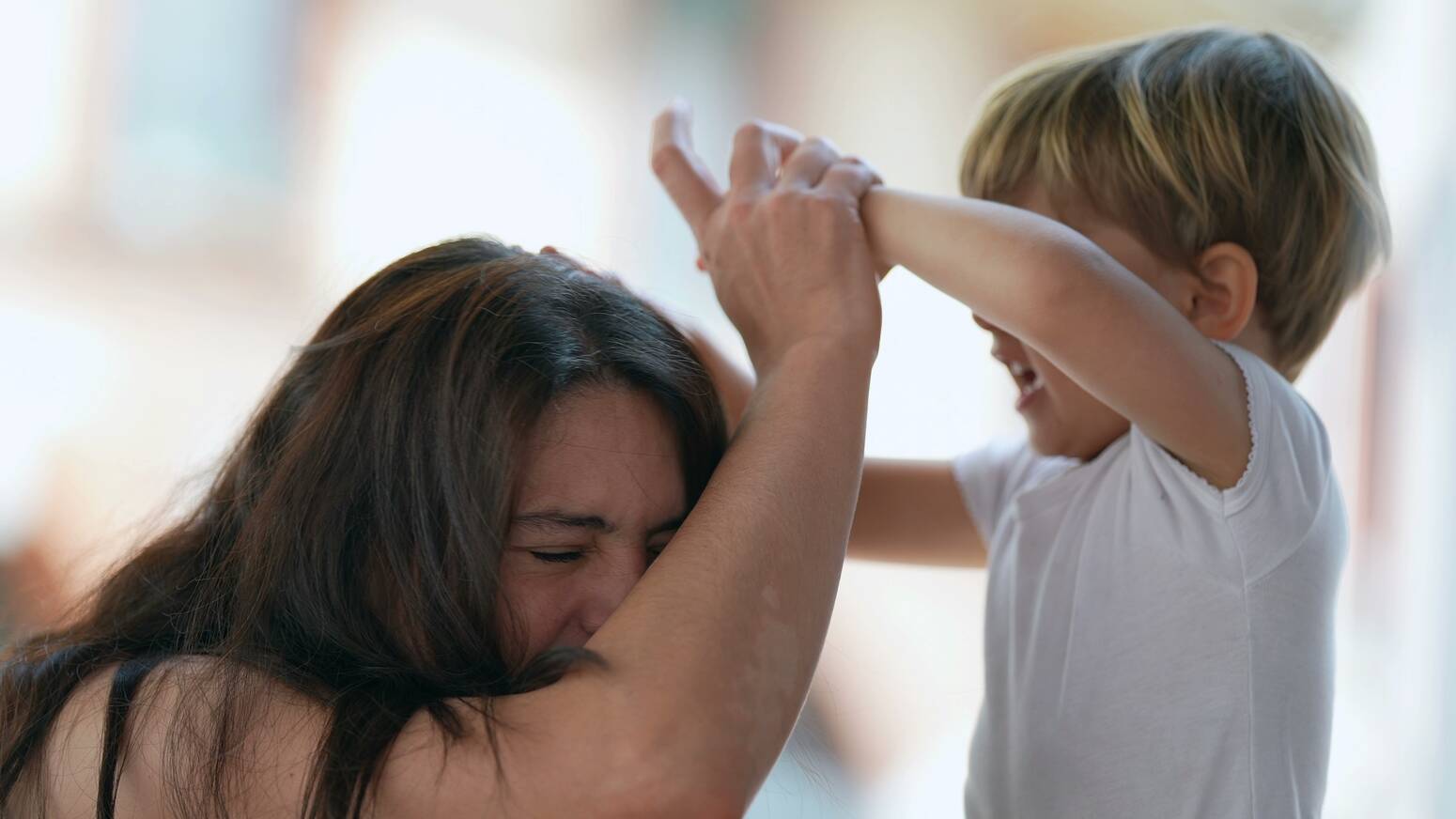 Parent-grabbing-child's-hand