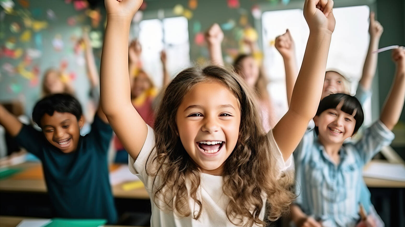 girl in front of classroom celebrating