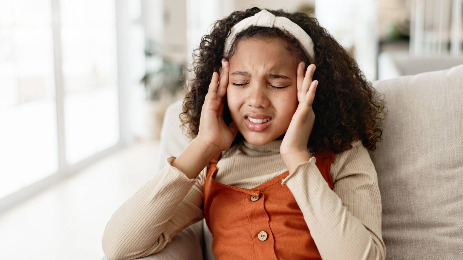 girl-holding-head-with-headache