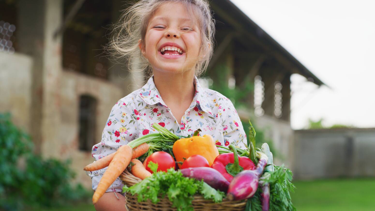 girl-smiling-with-vegetables