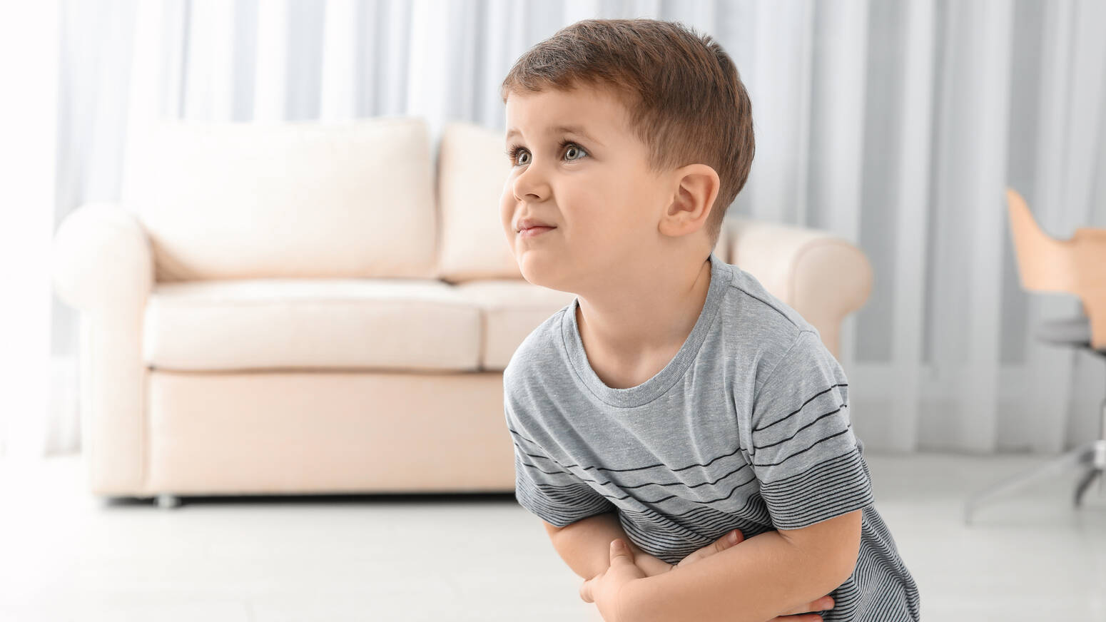 child-holding-stomach