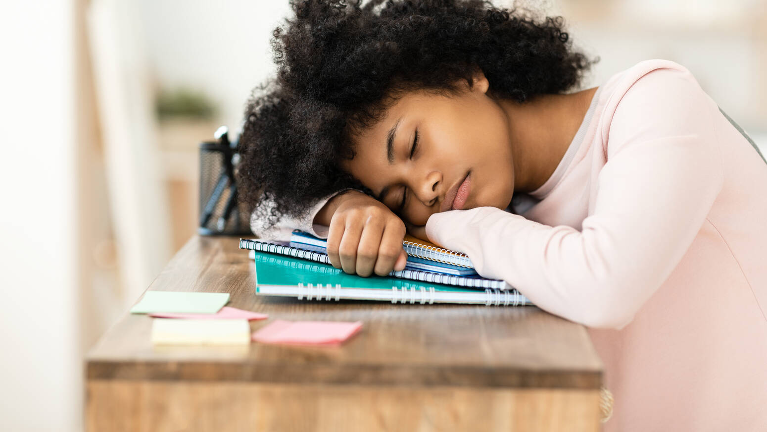 girl-sleeping-at-desk