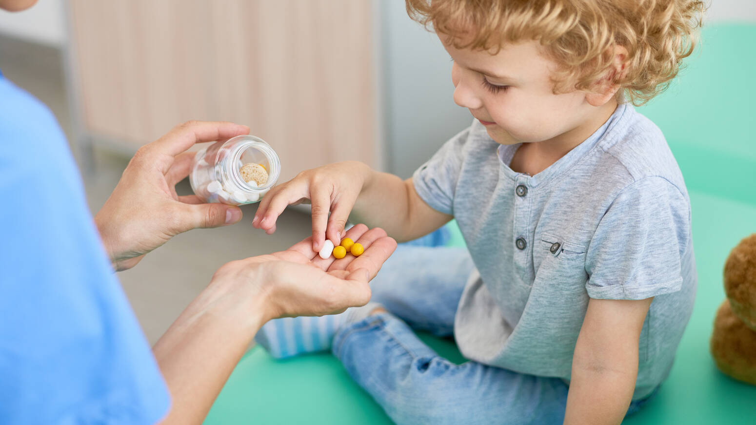 child-holding-medicine 