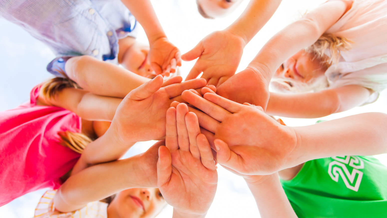 Group of kids in a hand stack