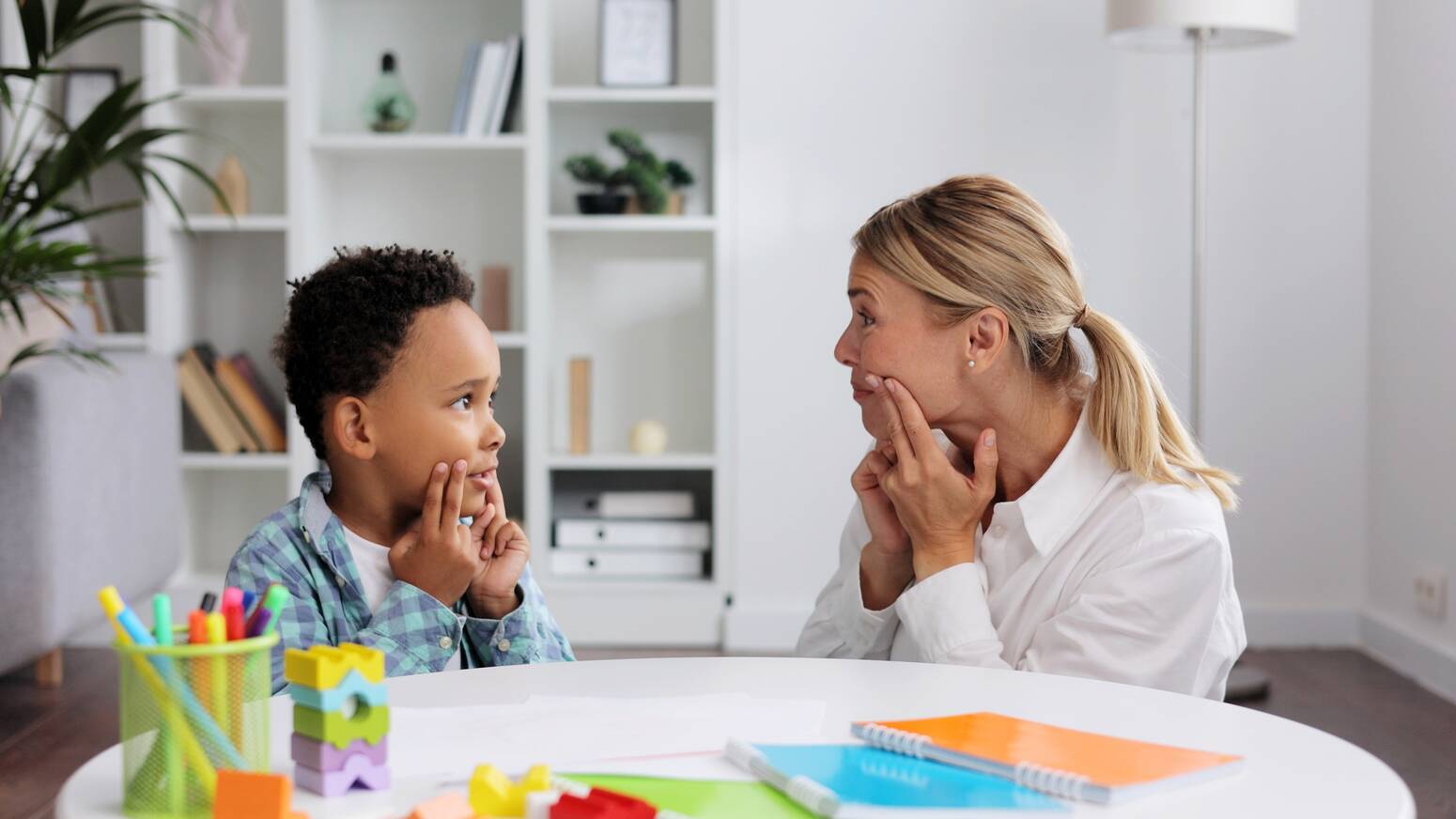 kid copying same movement as teacher