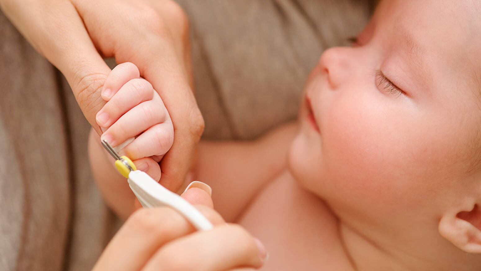 Newborn getting nails clipped