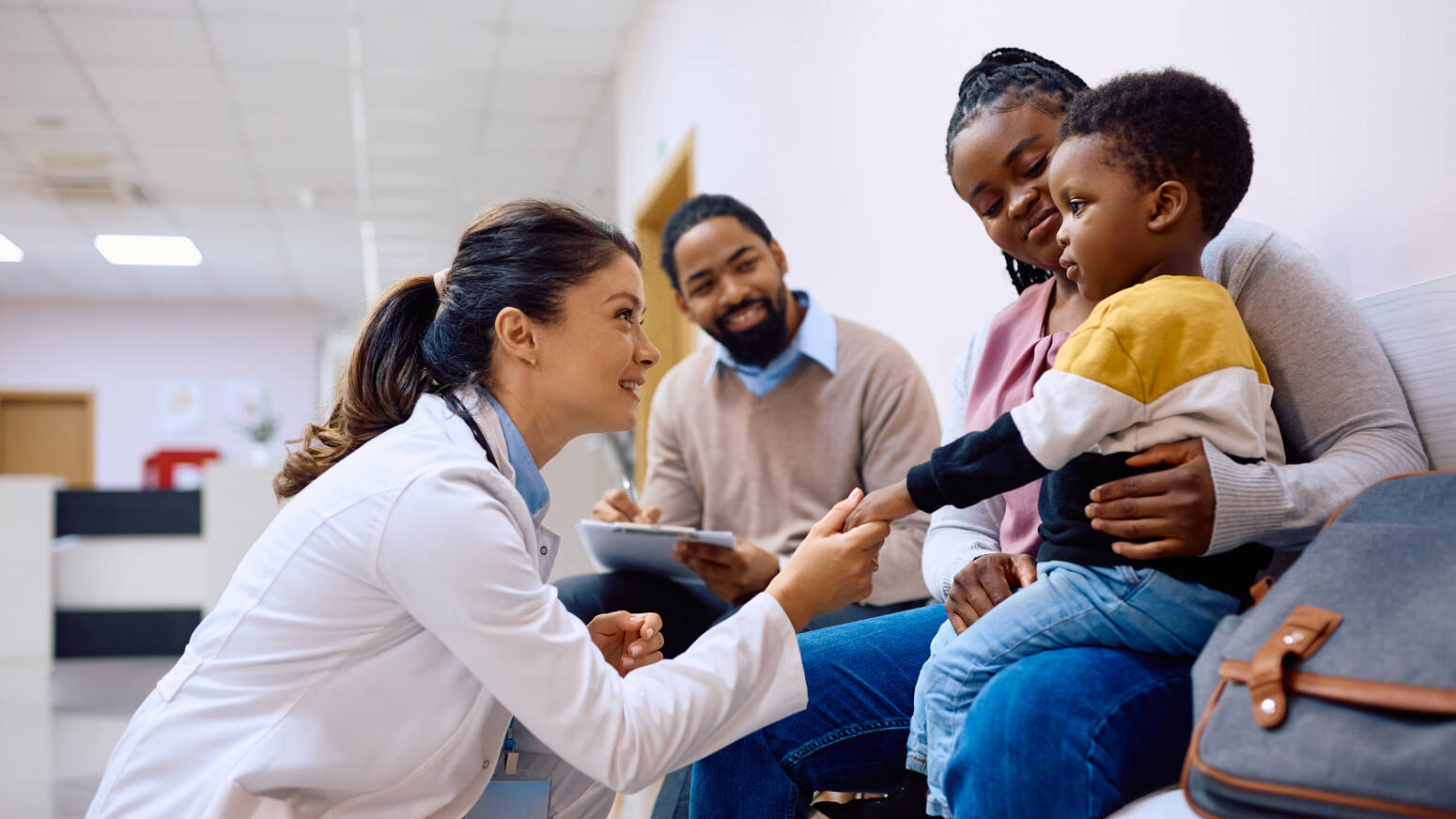pediatric doctor talking with family