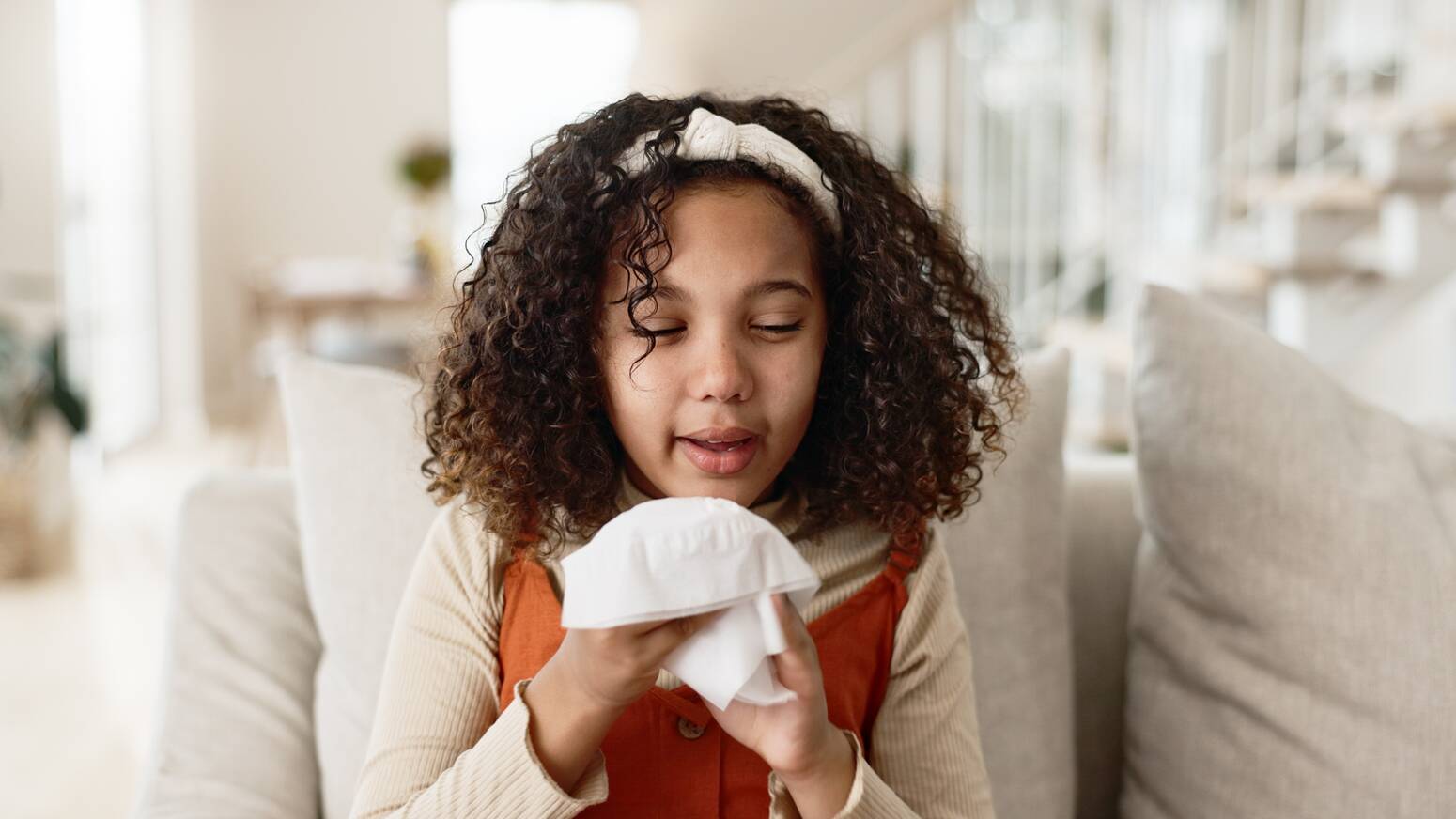 Young girl holding tissue