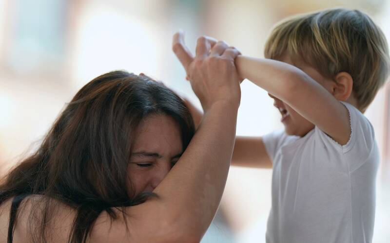 Parent-grabbing-child's-hand