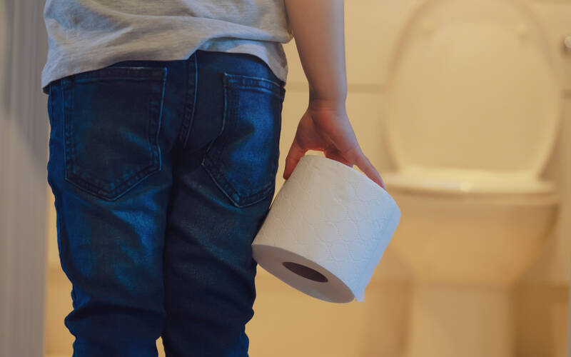 child-holding-toilet-paper