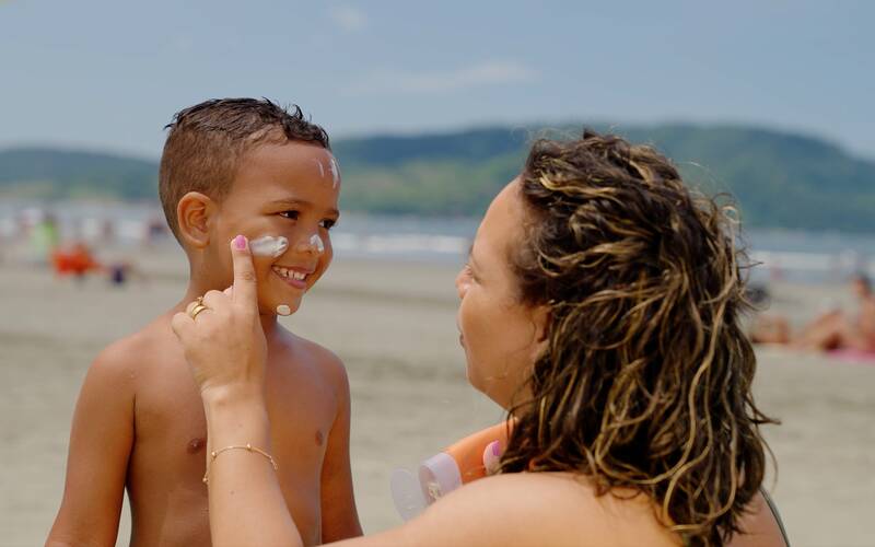 parent-applying-sunscreen-to-child