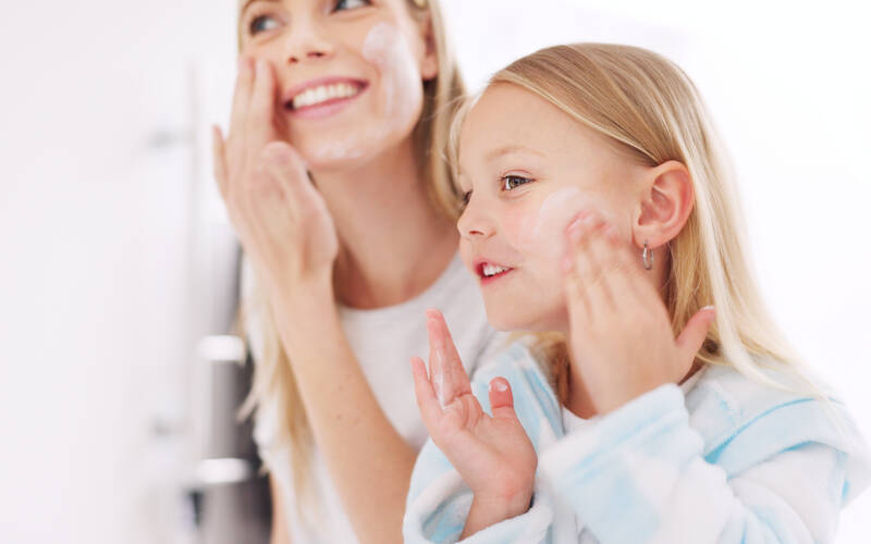 parent-and-child-applying-skincare