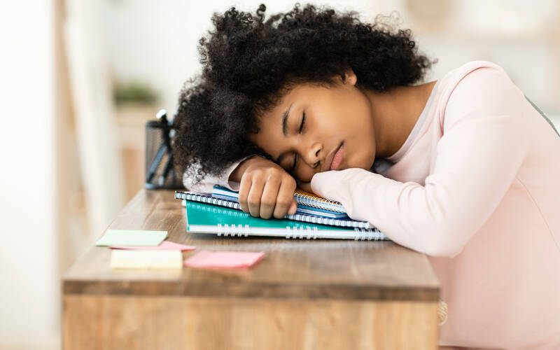 girl-sleeping-at-desk