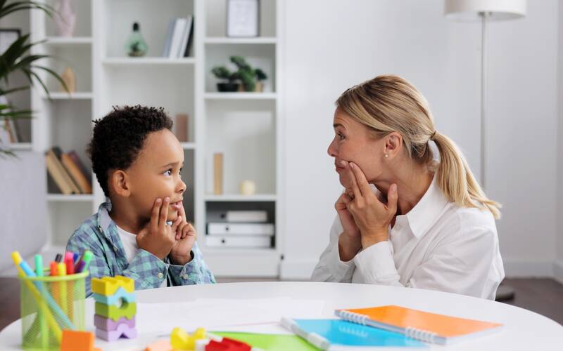 kid copying same movement as teacher