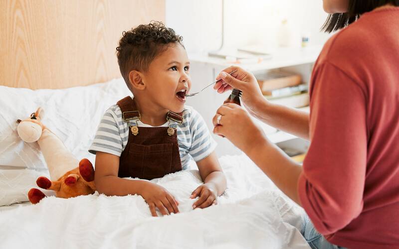 Kid given medicine 