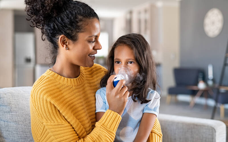 parent-helping-child-with-nebulizer