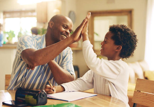 Child-and-parent-high-fiving