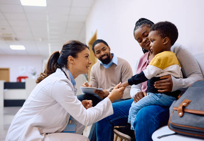 pediatric doctor talking with family 