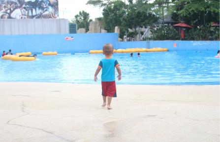 Child approaching water with no life vest on.