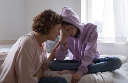 Mother talking to daughter