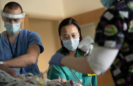 Photo of respiratory therapist training how to provide oxygen to a child